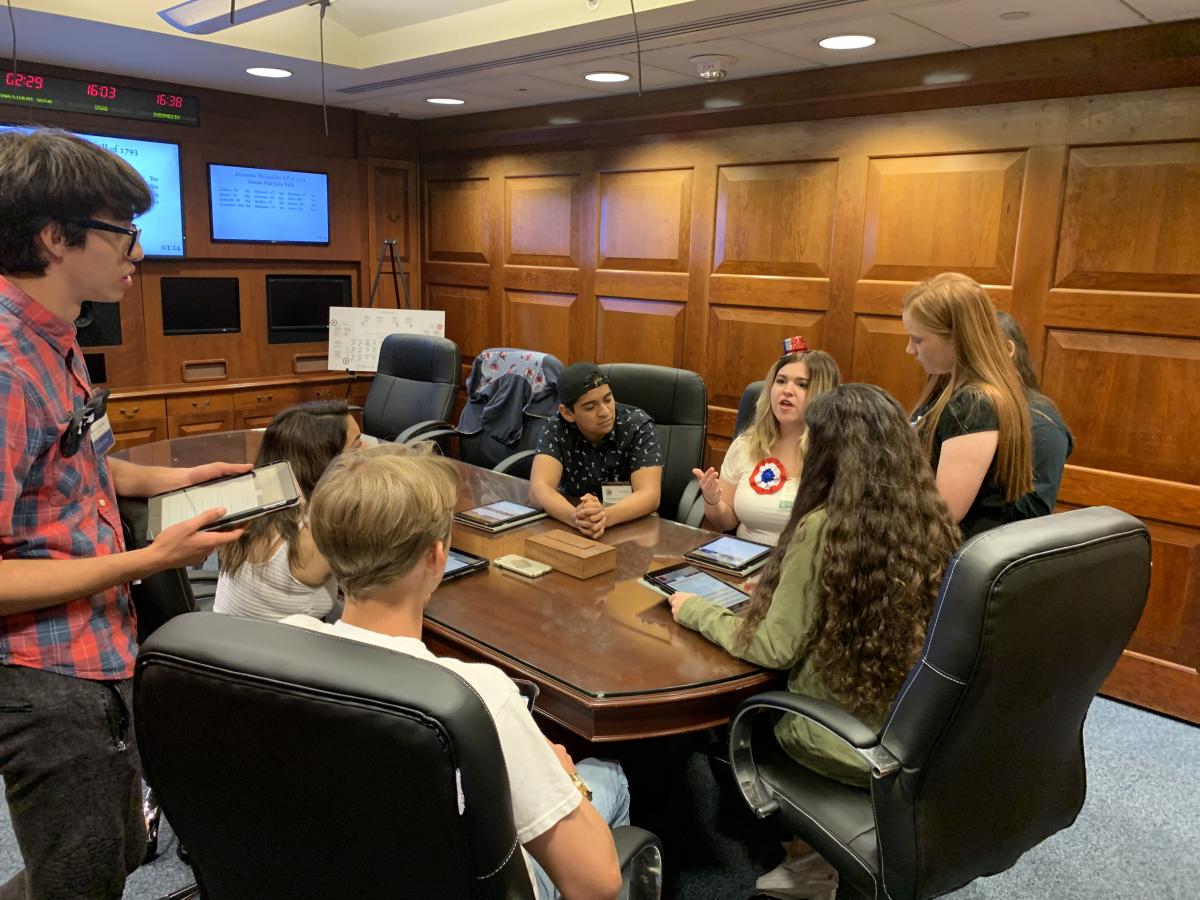 Students playing the Situation Room Experience: Washington's Cabinet
